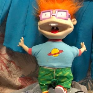 A Rugrat , 12 inches tall, has a pull chain that when it’s pulled , he shakes!!!